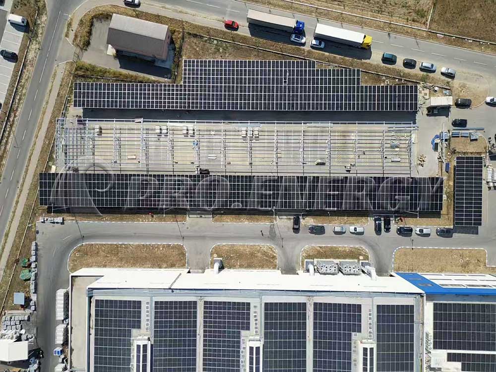 Aerial view of PROFENCE.ENERGY large‑scale solar carport project, completed PV carport canopy for commercial parking lot